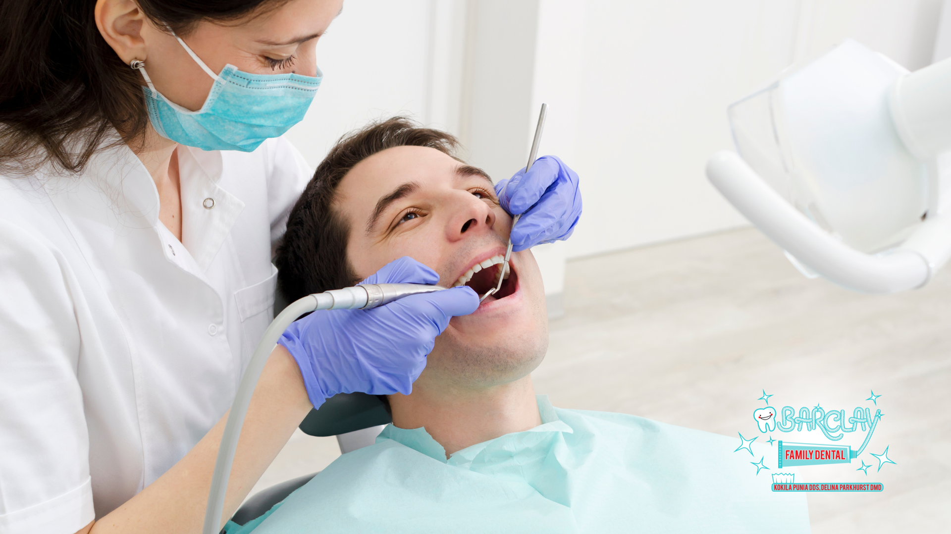 Dentist examining a patient's teeth with tools in a dental office.
