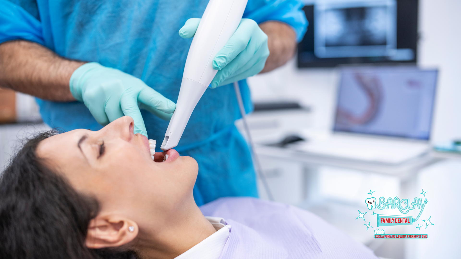 A woman is getting her teeth examined by a dentist.