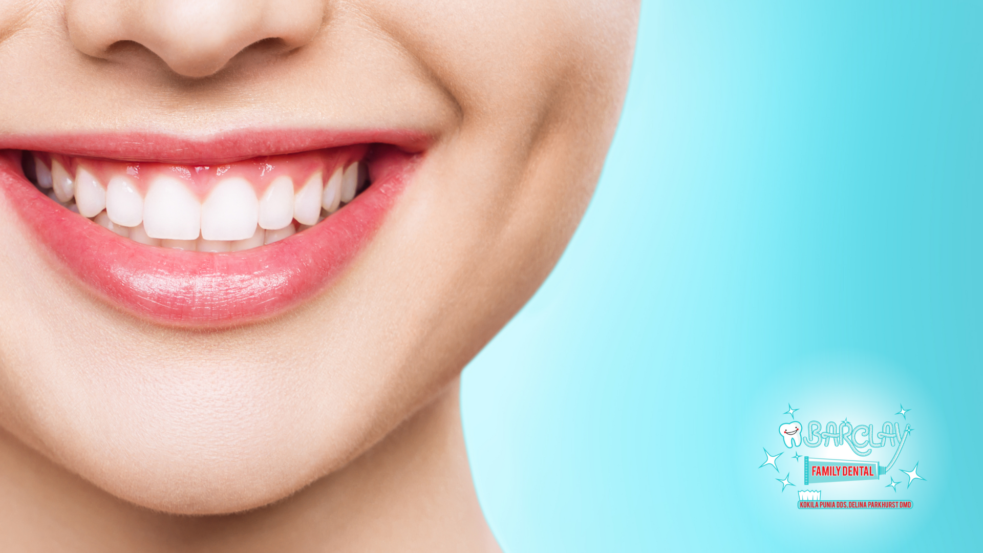 Smiling woman with bright white teeth and pink lips against a blue background.