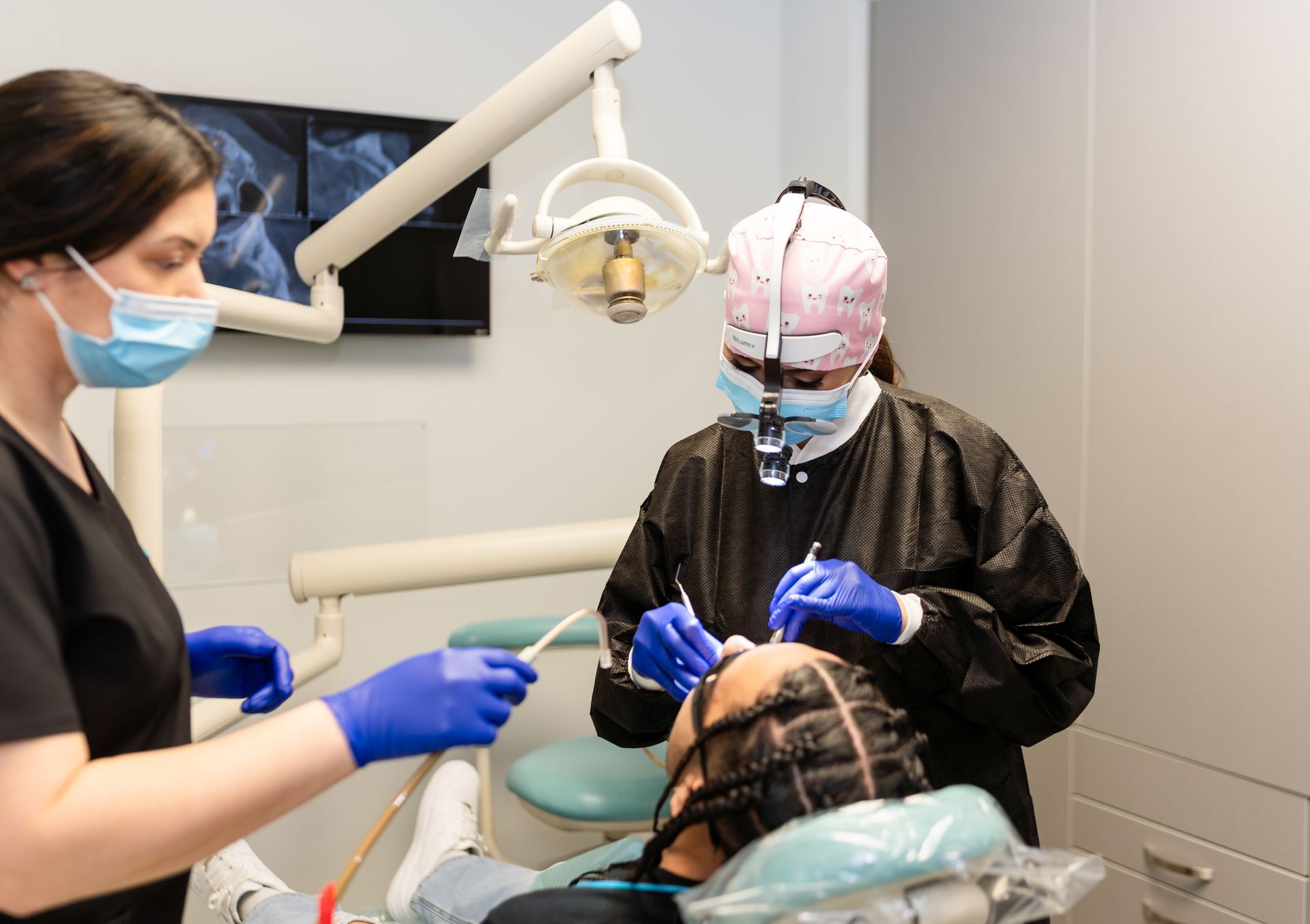 a family is posing for a picture while sitting on a couch | Barclay Family Dental | Best Dentist For Family Dentistry, Dental Implants, and Cosmetic Dentistry in Cherry Hill, NJ