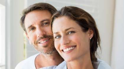 a man and a woman are smiling for the camera | Barclay Family Dental | Best Dentist For Family Dentistry, Dental Implants, and Cosmetic Dentistry in Cherry Hill, NJ