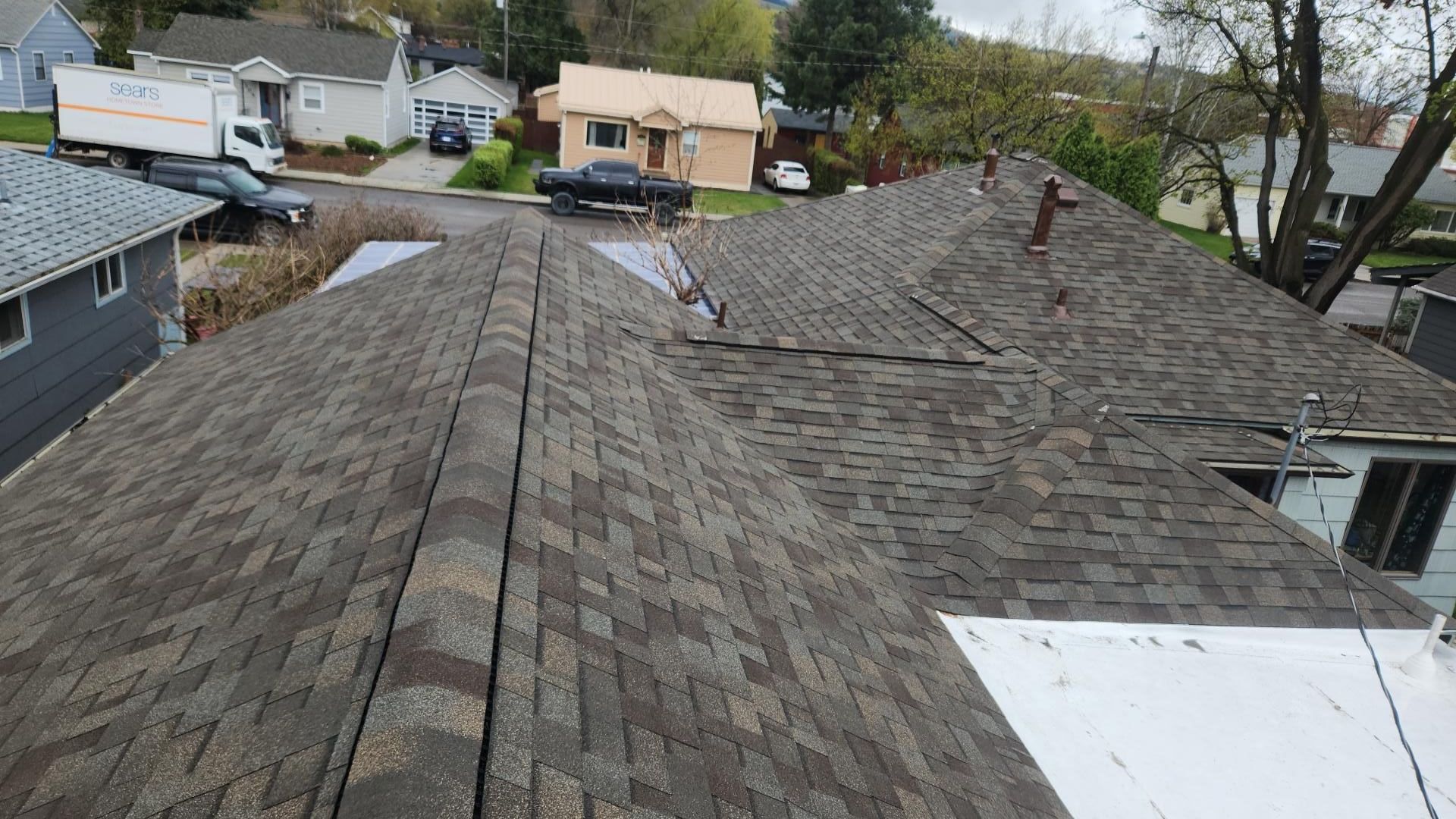 An aerial view of a house with a roof and a window.