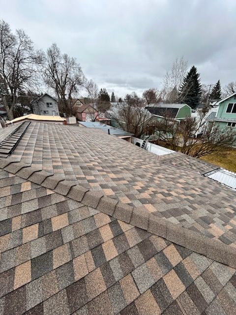 An aerial view of a house with a roof and a window.