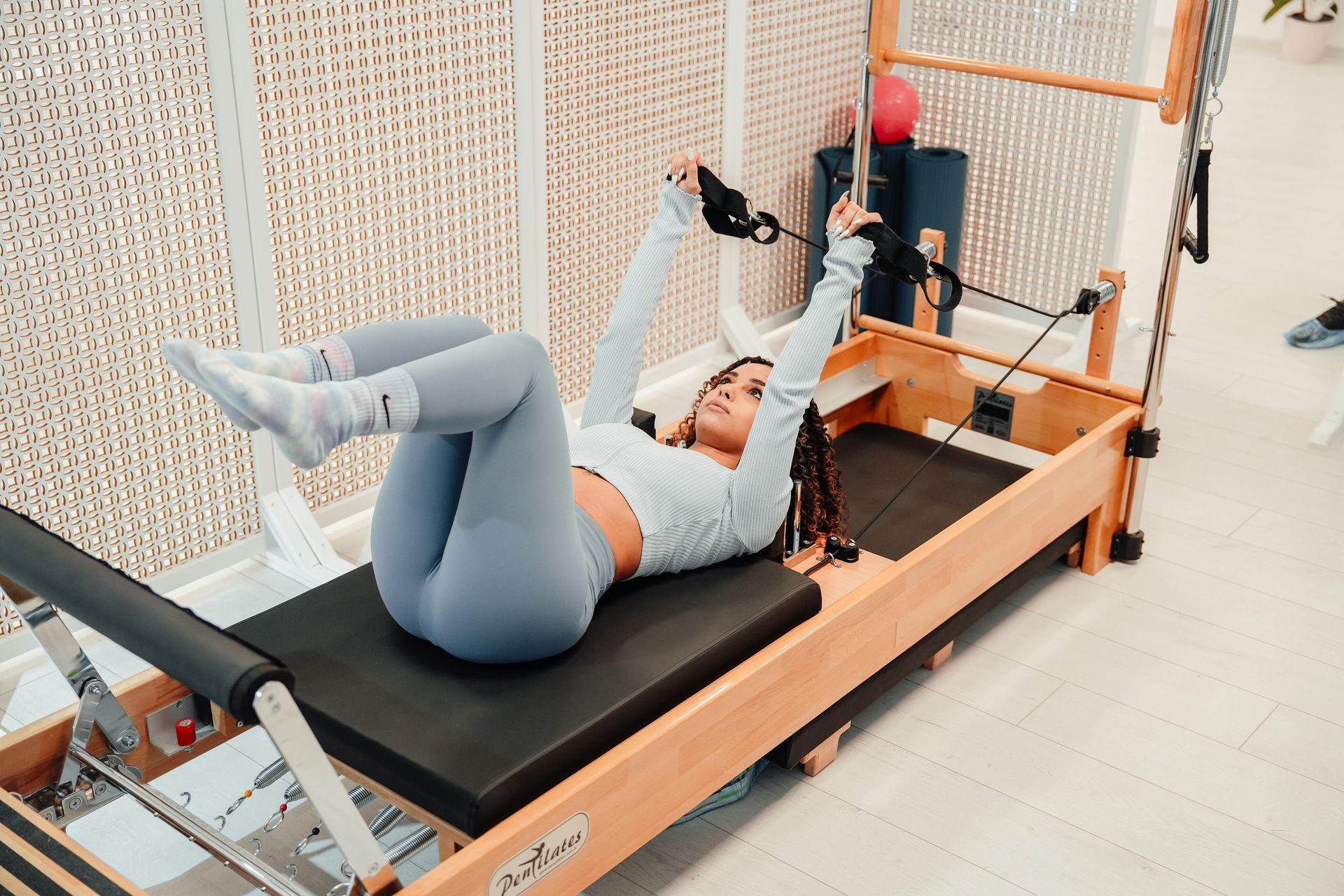 Woman in light blue workout clothes doing