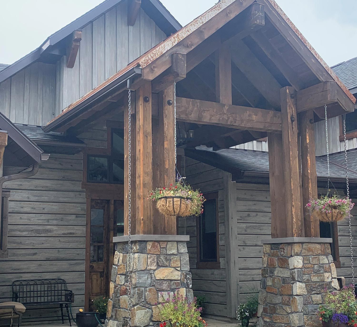 House Wooden Porch And Stone Pillars — Stevensville, MT — 406 Seamless Gutters