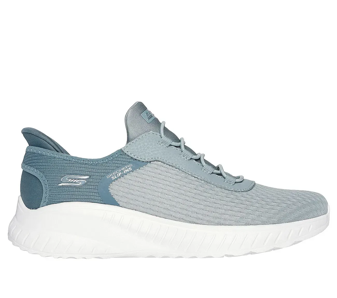 Zapatilla deportiva gris y azul con suela blanca.
