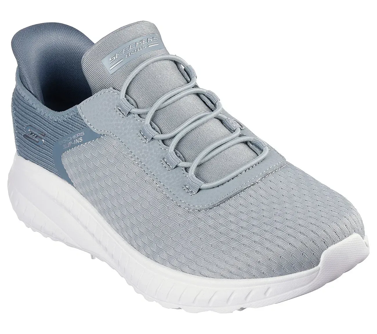 Zapatilla deportiva gris y azul con suela blanca.