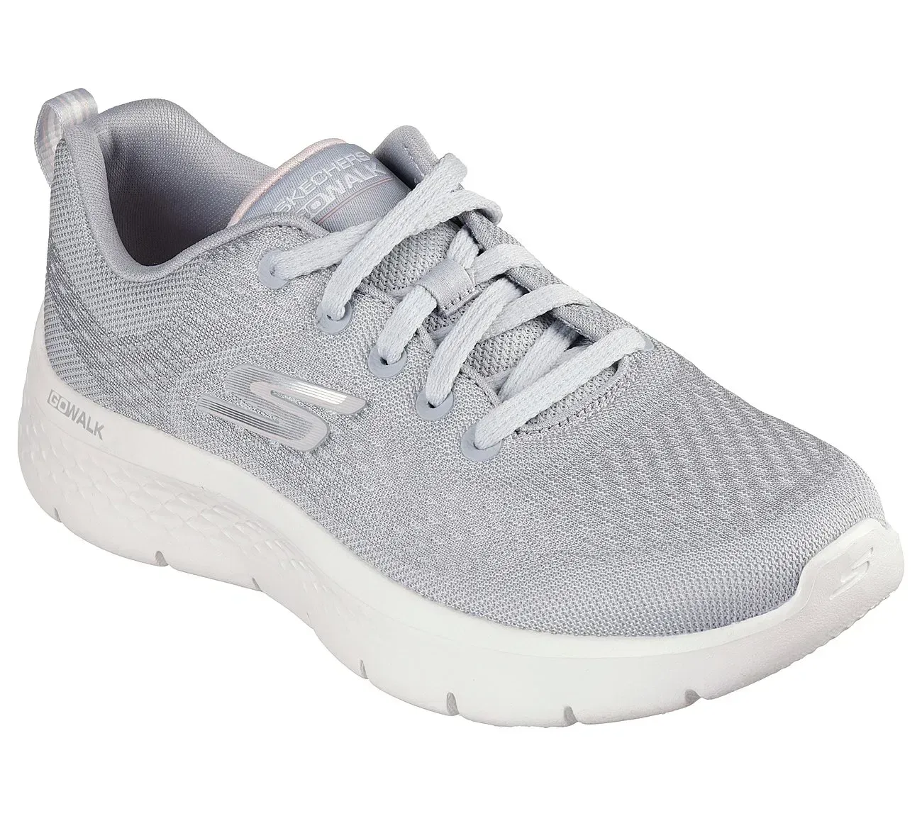 Zapatilla deportiva Skechers gris y blanca con cordones.