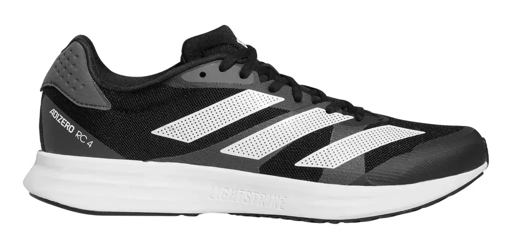 Zapatilla de running Adidas en blanco y negro con rayas y suela blancas.