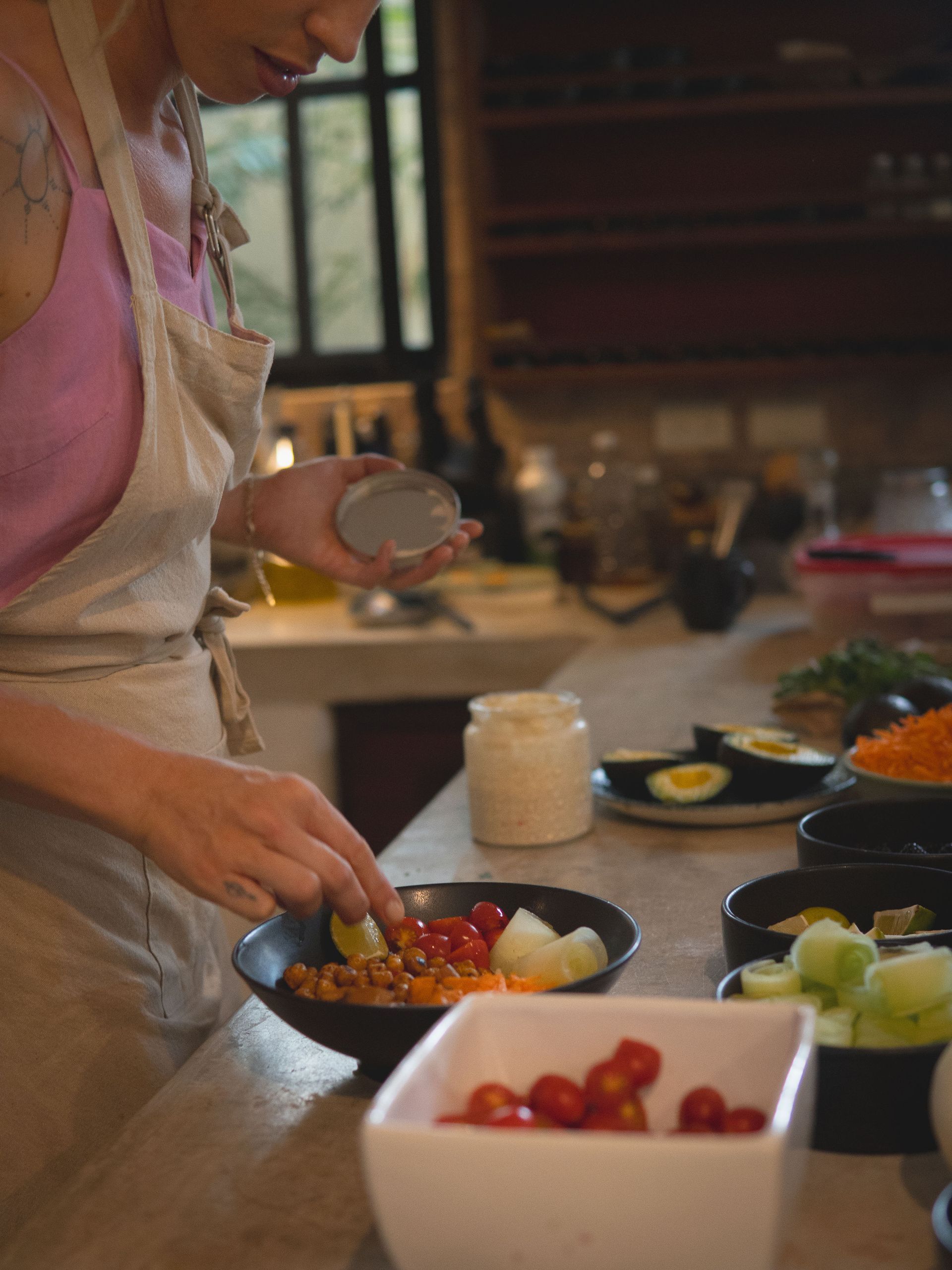 Bohemian-style kitchen with stone walls, wooden accents, and woven pendant lights.