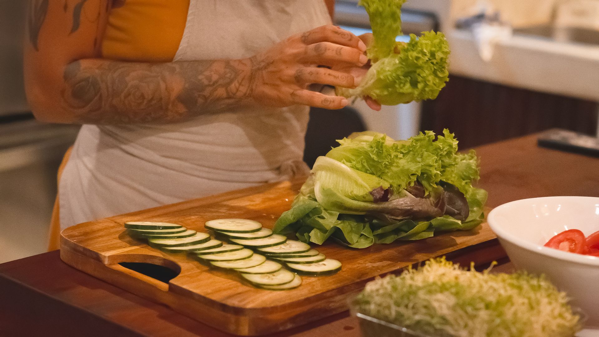 Bohemian-style kitchen with stone walls, wooden accents, and woven pendant lights.