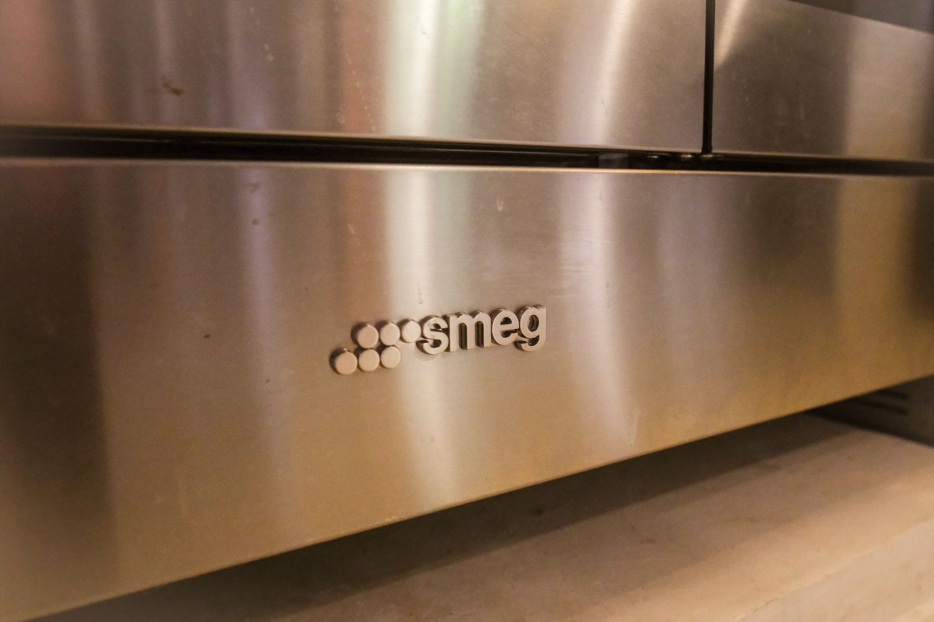 Stainless steel oven with the Smeg logo.