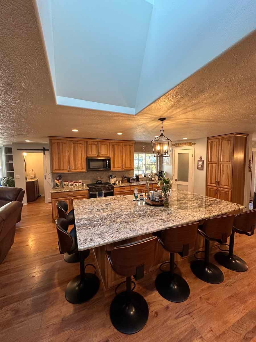 There is a large island in the middle of the kitchen.