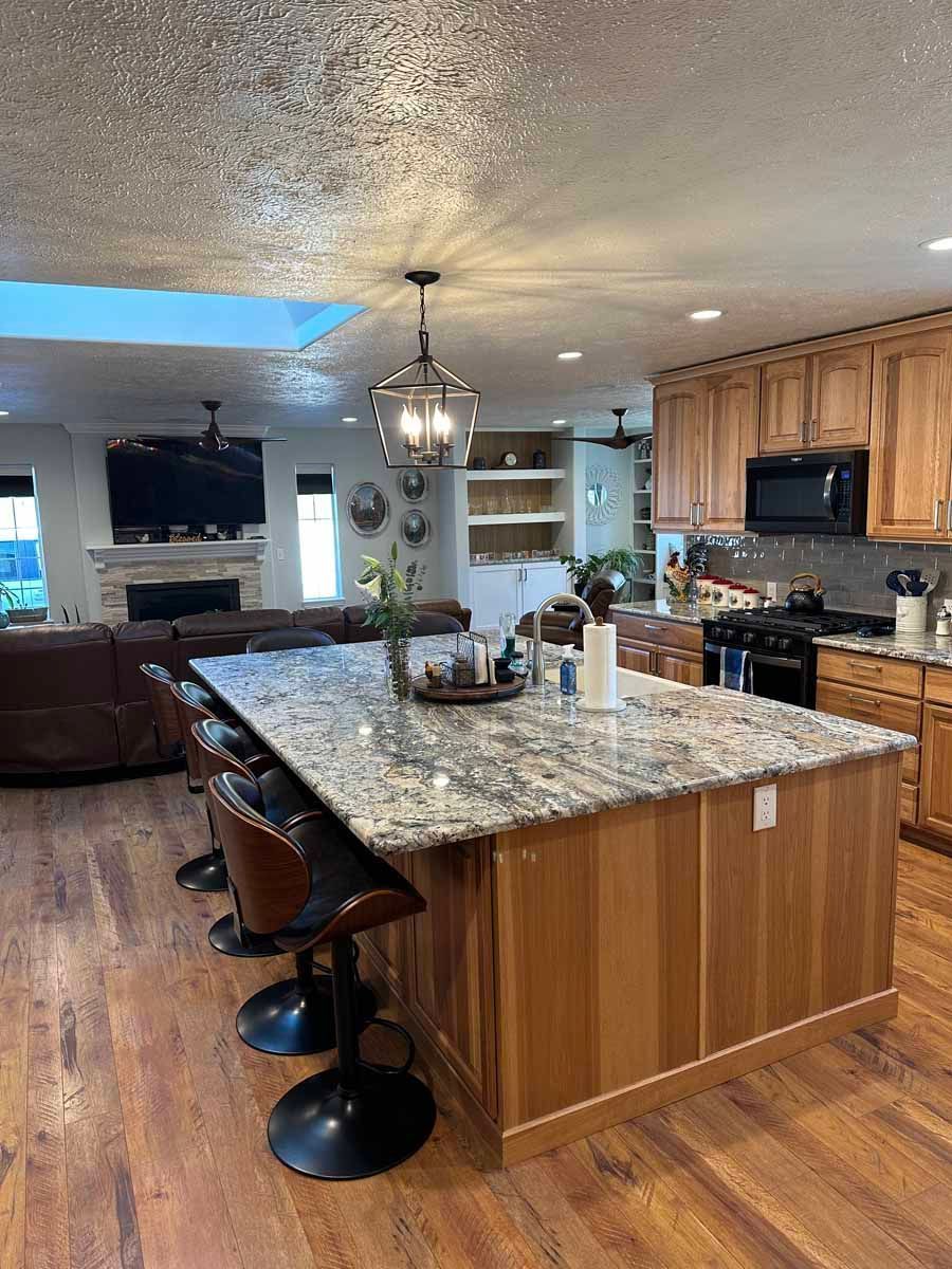 There is a large island in the middle of the kitchen.