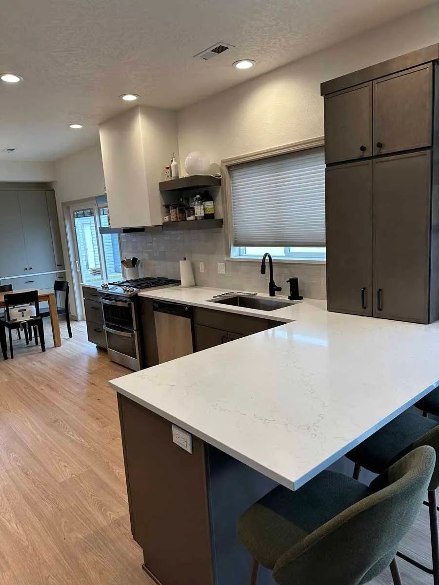 A kitchen with a large island in the middle of the room.