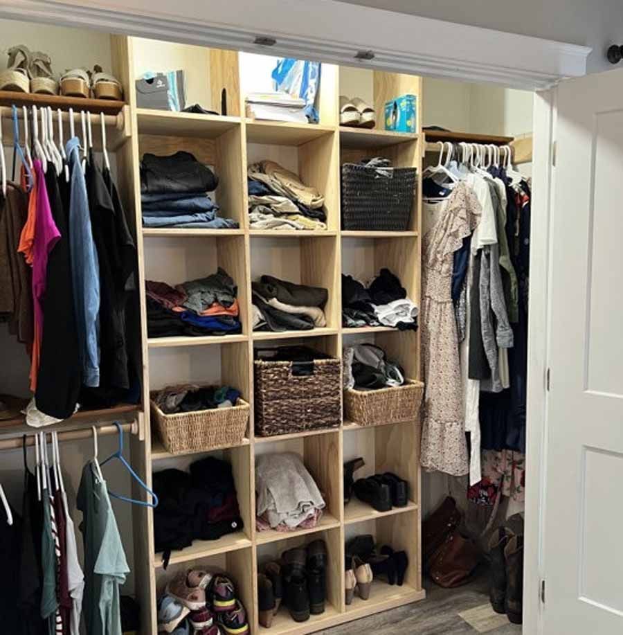 A closet filled with lots of clothes and shoes