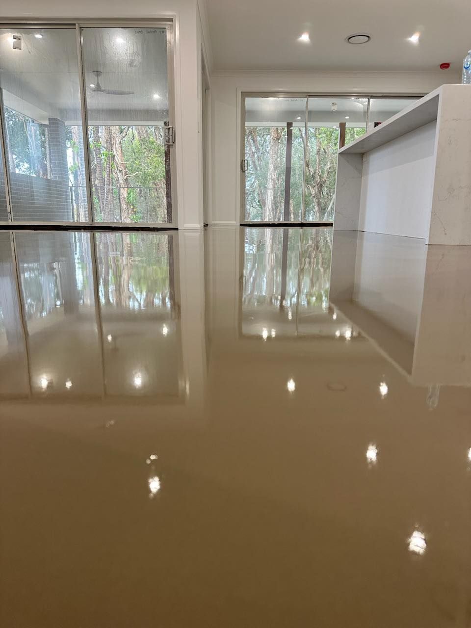 Polished concrete flooring in the living room — Charmhaven Carpets in Hunter Valley, NSW