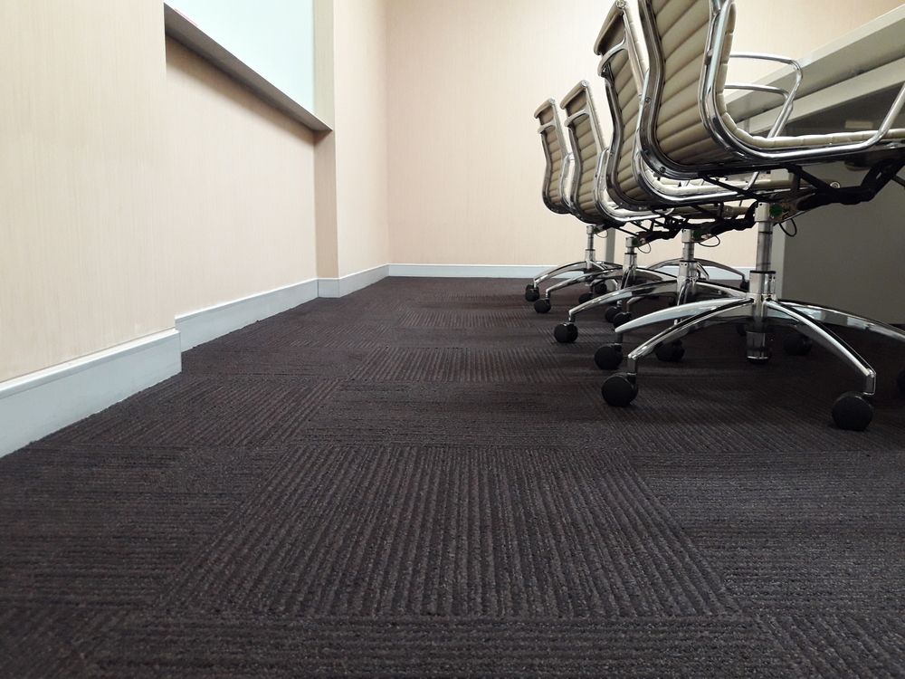 A Row of Office Chairs Are Lined Up in a Conference Room — Charmhaven Carpets In Charmhaven, NSW