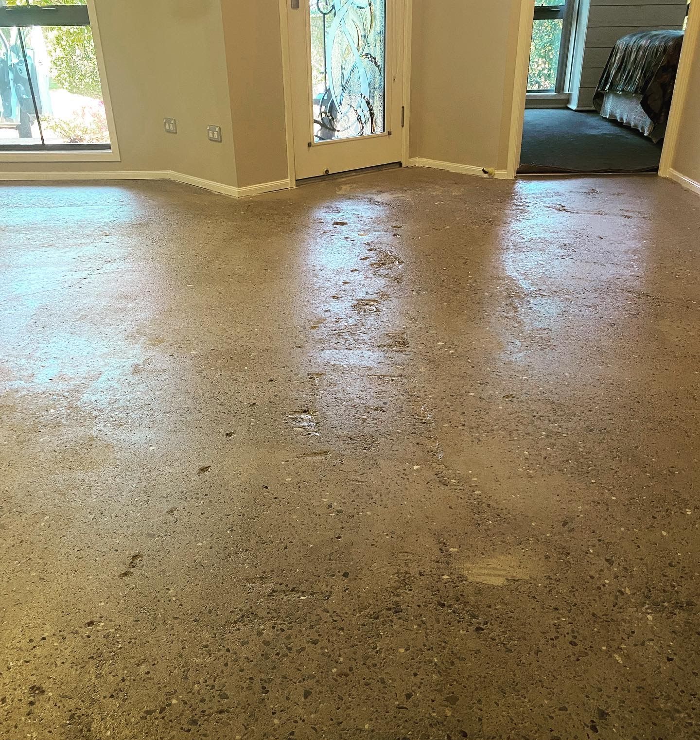 A Room With a Carpeted Floor and a Sliding Glass Door — Charmhaven Carpets In Charmhaven, NSW
