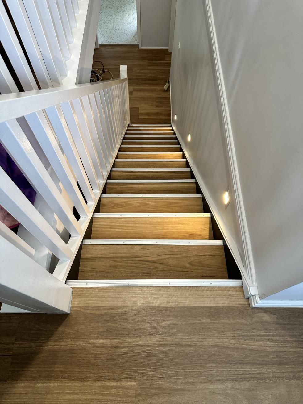 The Stairs Are Made of Wood and Have a White Railing — Charmhaven Carpets In Charmhaven, NSW