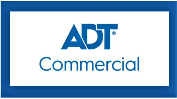 Woman in glasses using a point-of-sale system at a counter, smiling while interacting with a payment device.