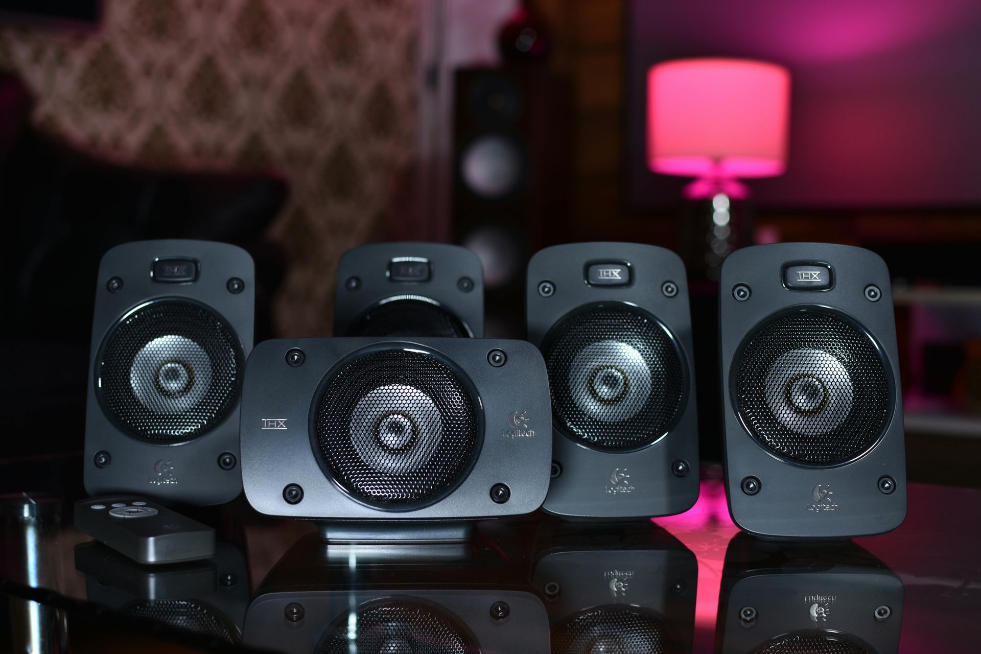 White doorbell camera on a brown door, near a black doorknob and lock.