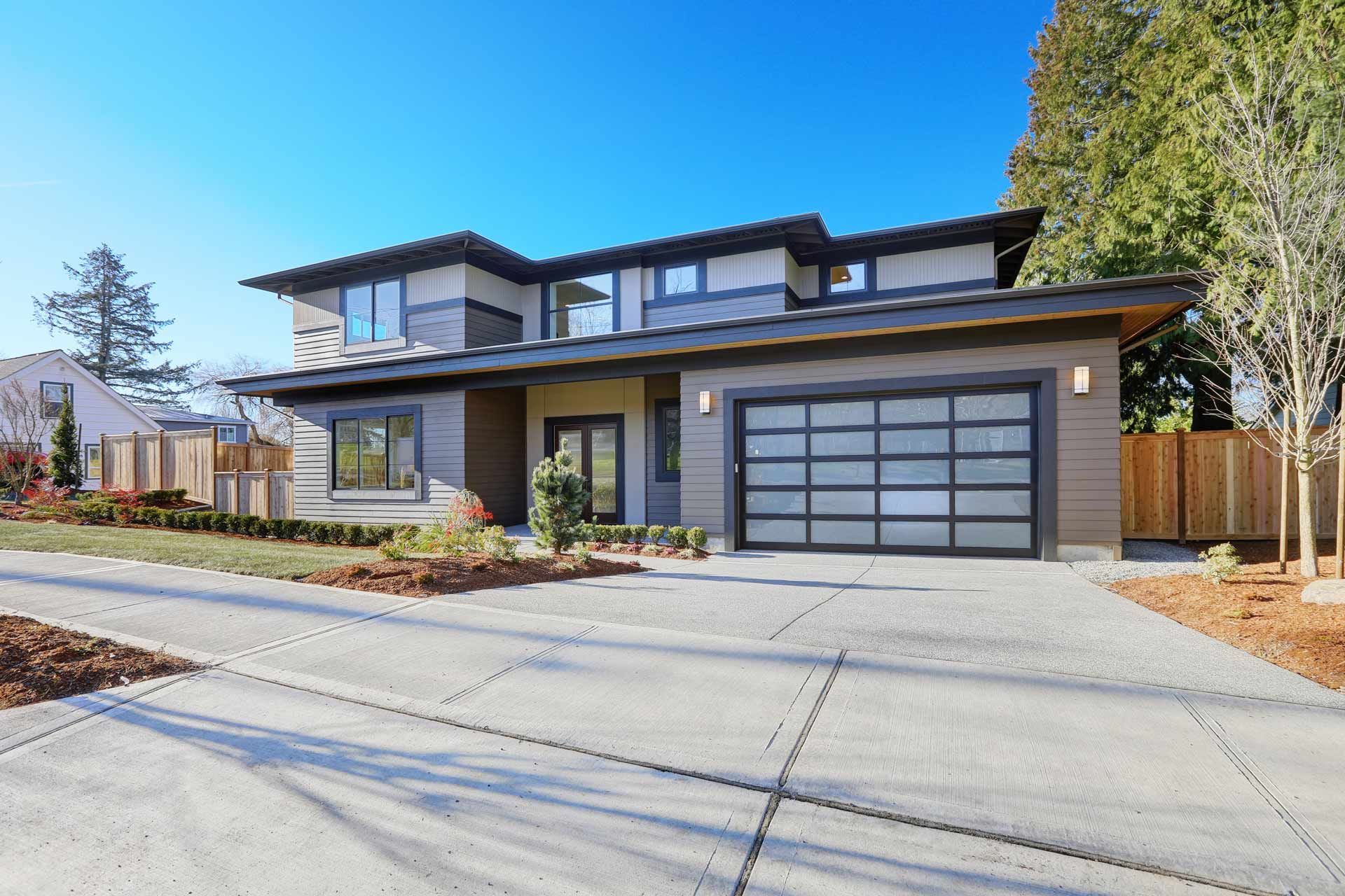 Modern two-story house with a gray garage door