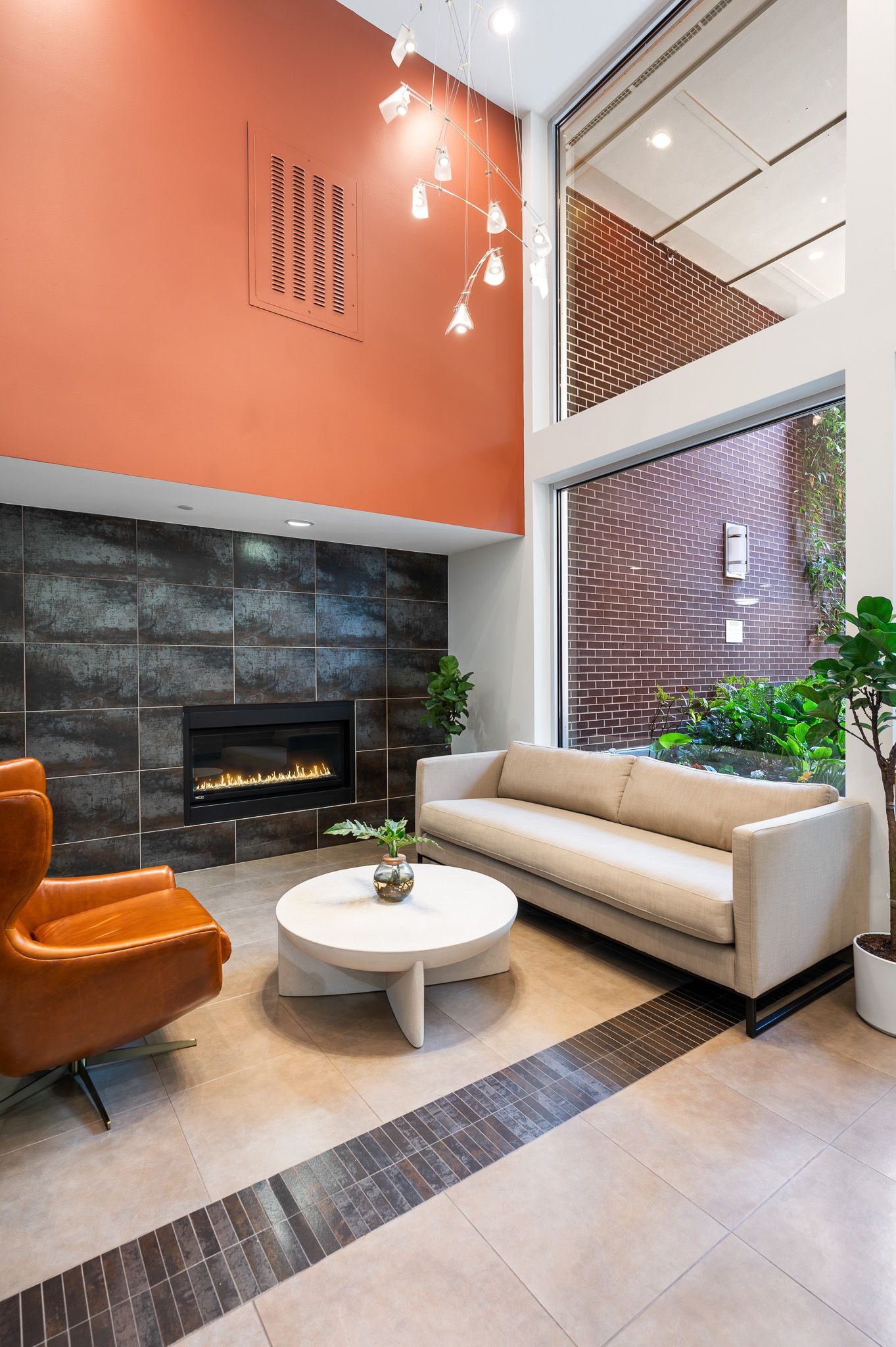 Photo of the chair and the couch and fire place in the lobby