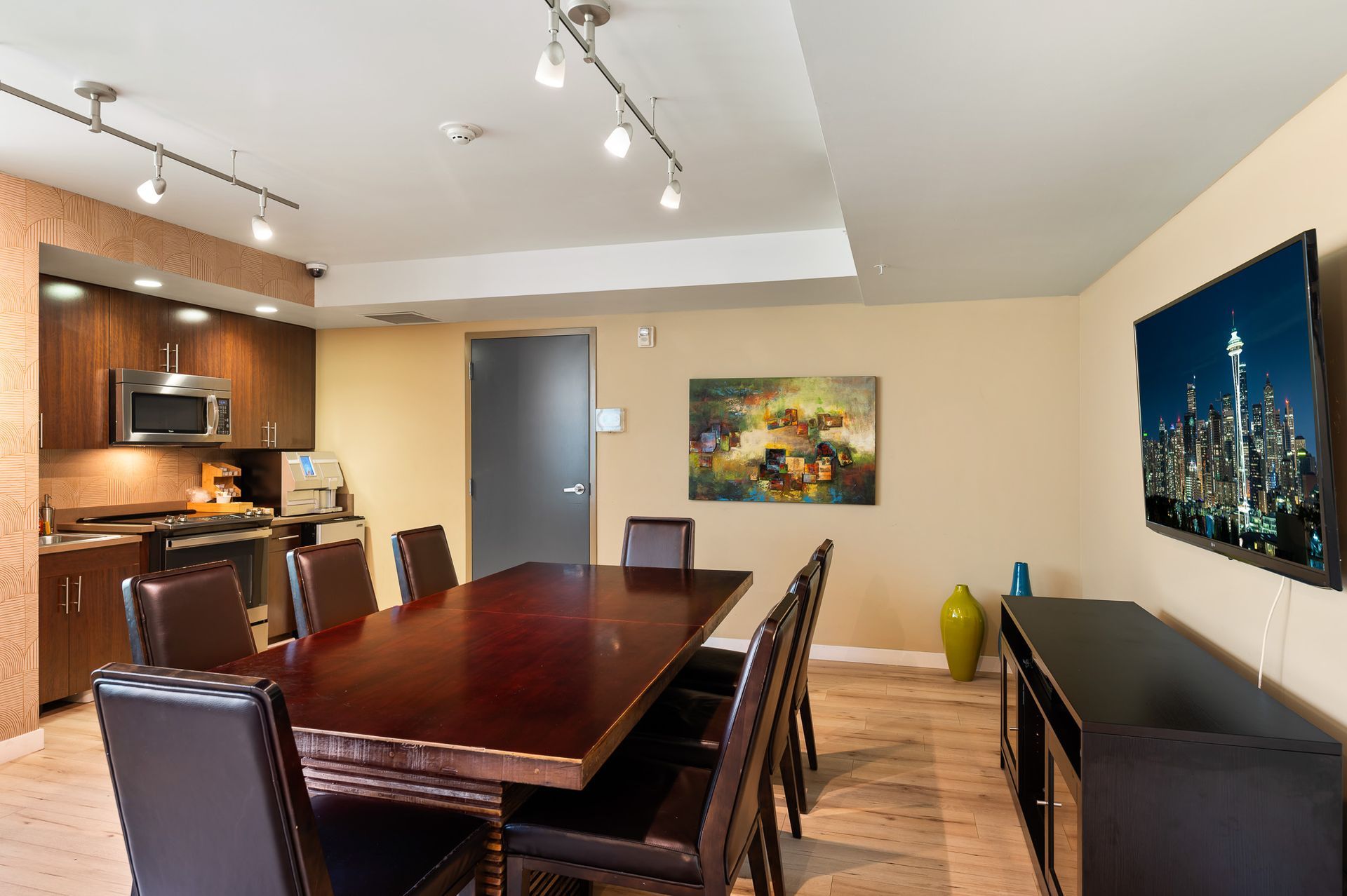 Photo of the boardroom, showing the kitchen in the background
