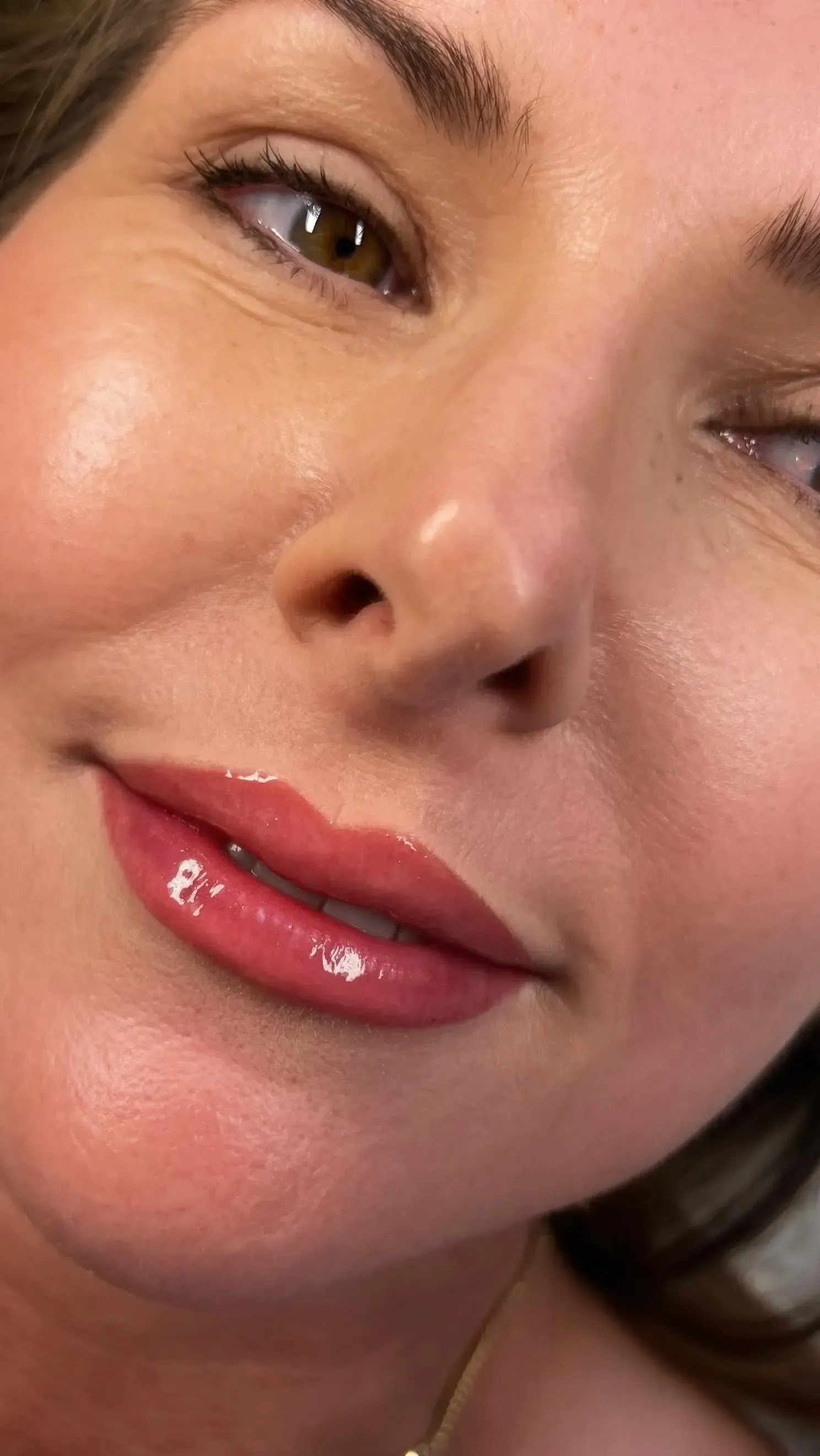 A close up of a woman 's face with red lips.