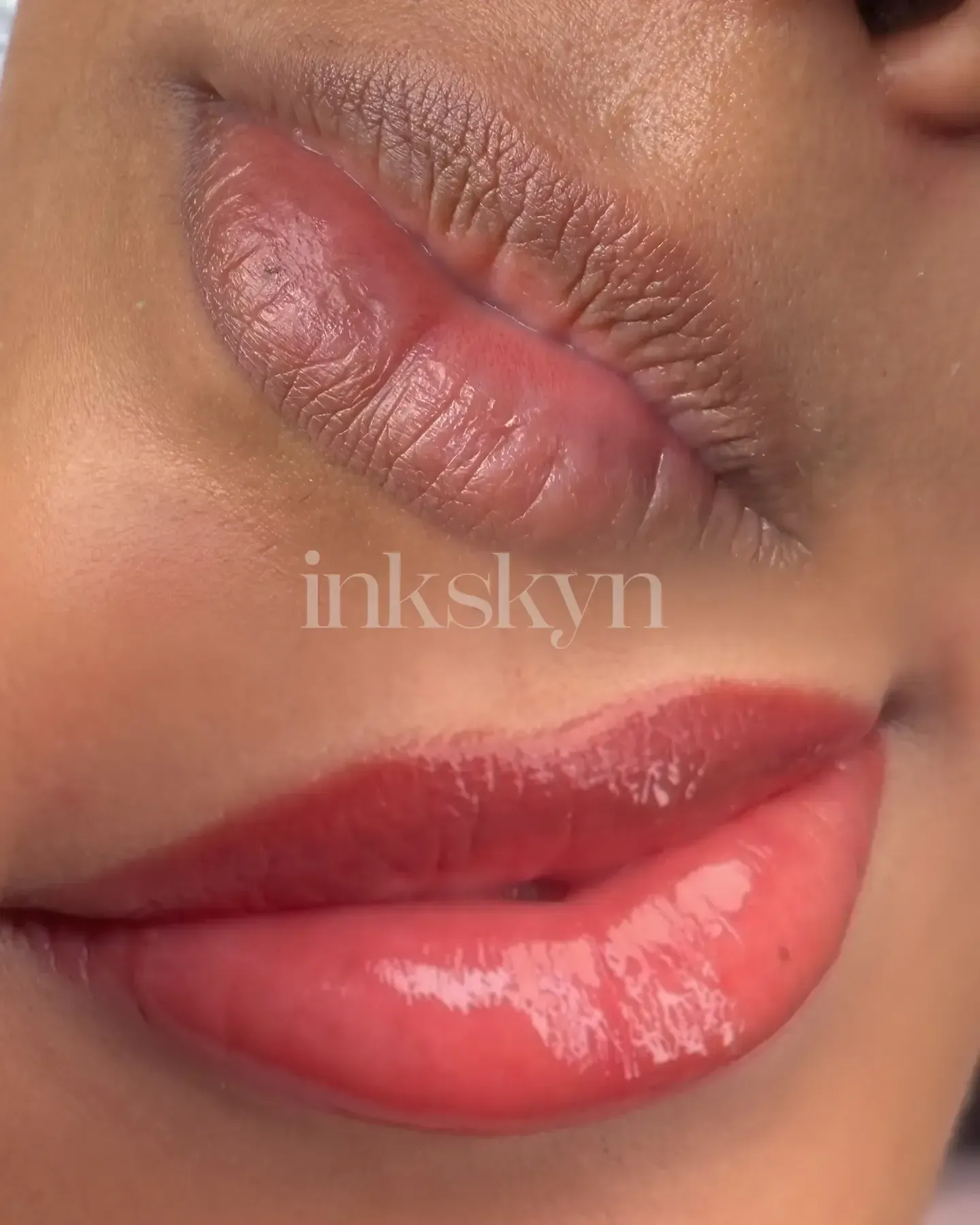A close up of a woman 's lips with red lipstick.