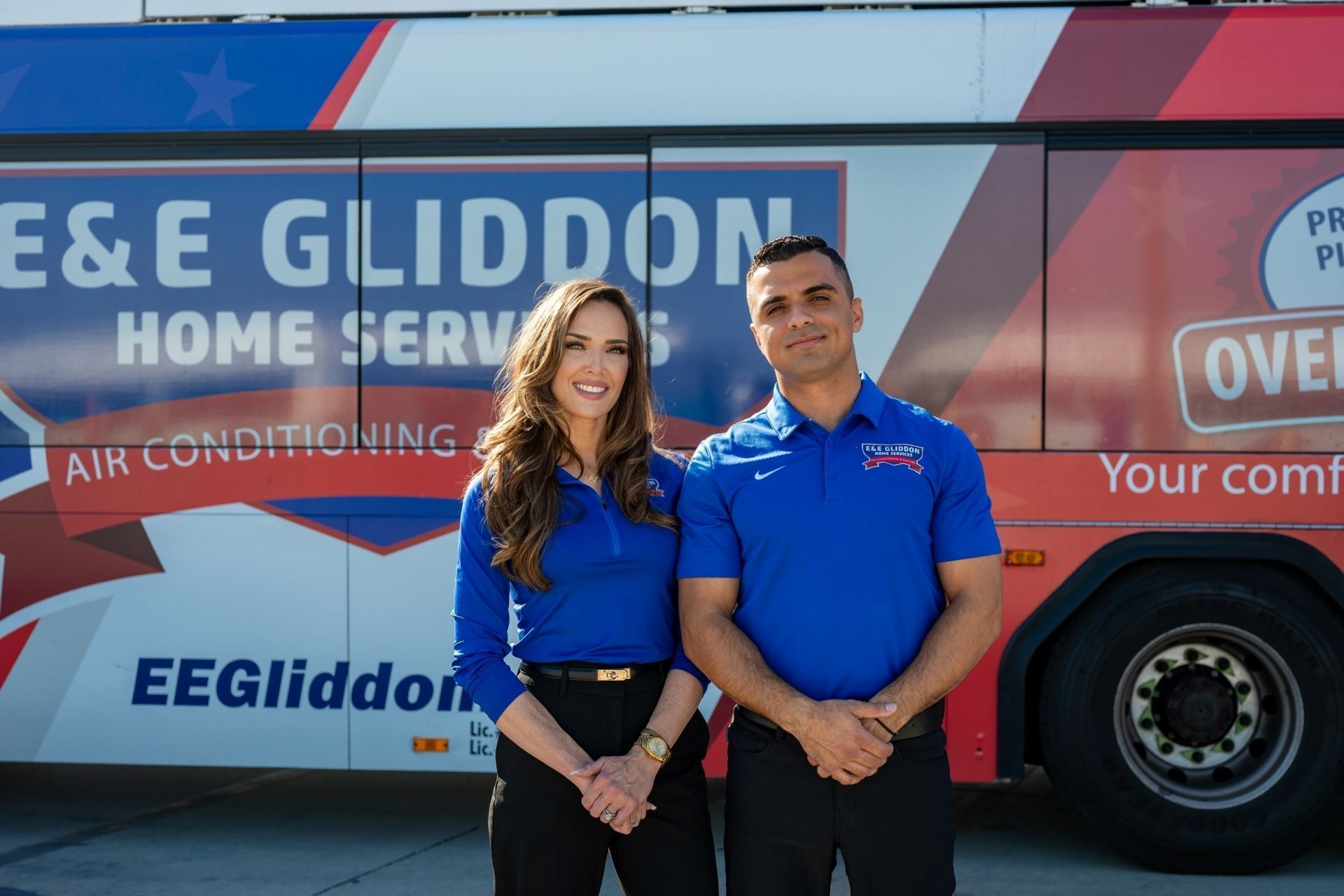EE Gliddon home services van with two people standing in front, in blue shirts