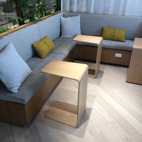 A living room with a couch and two tables