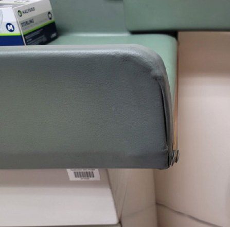 A box of sterile gloves sits on a changing table