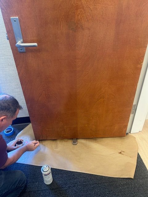 A wooden table is sitting on a wooden floor in a room.