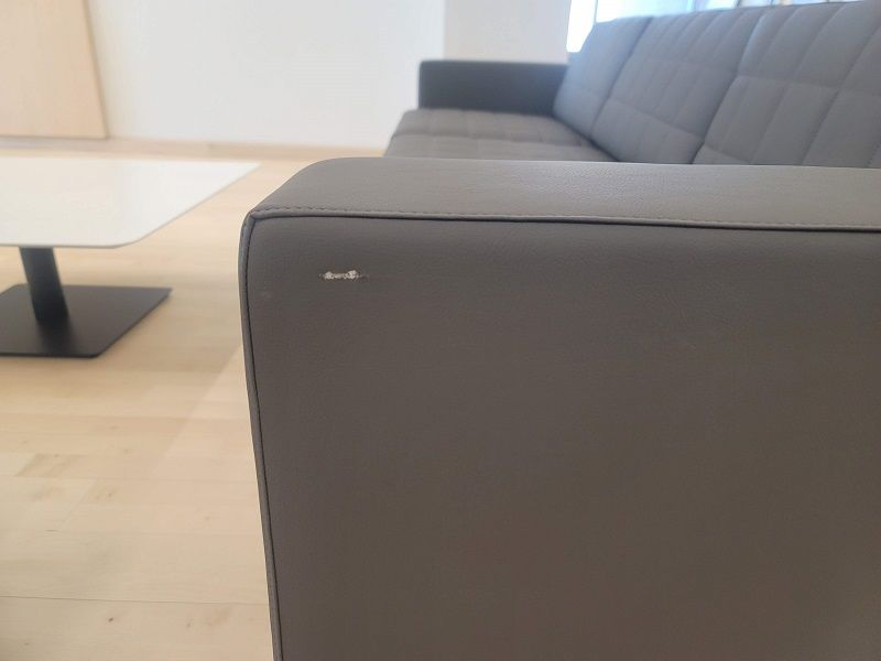 A close up of a chair with a hole in it.