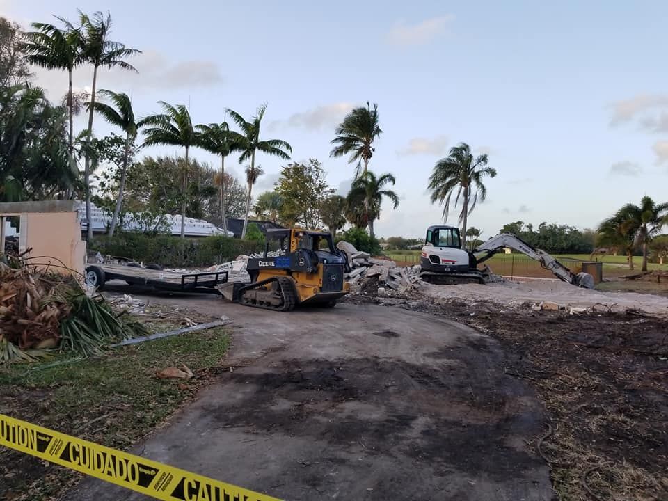 A construction site with a lot of machinery and a caution tape.