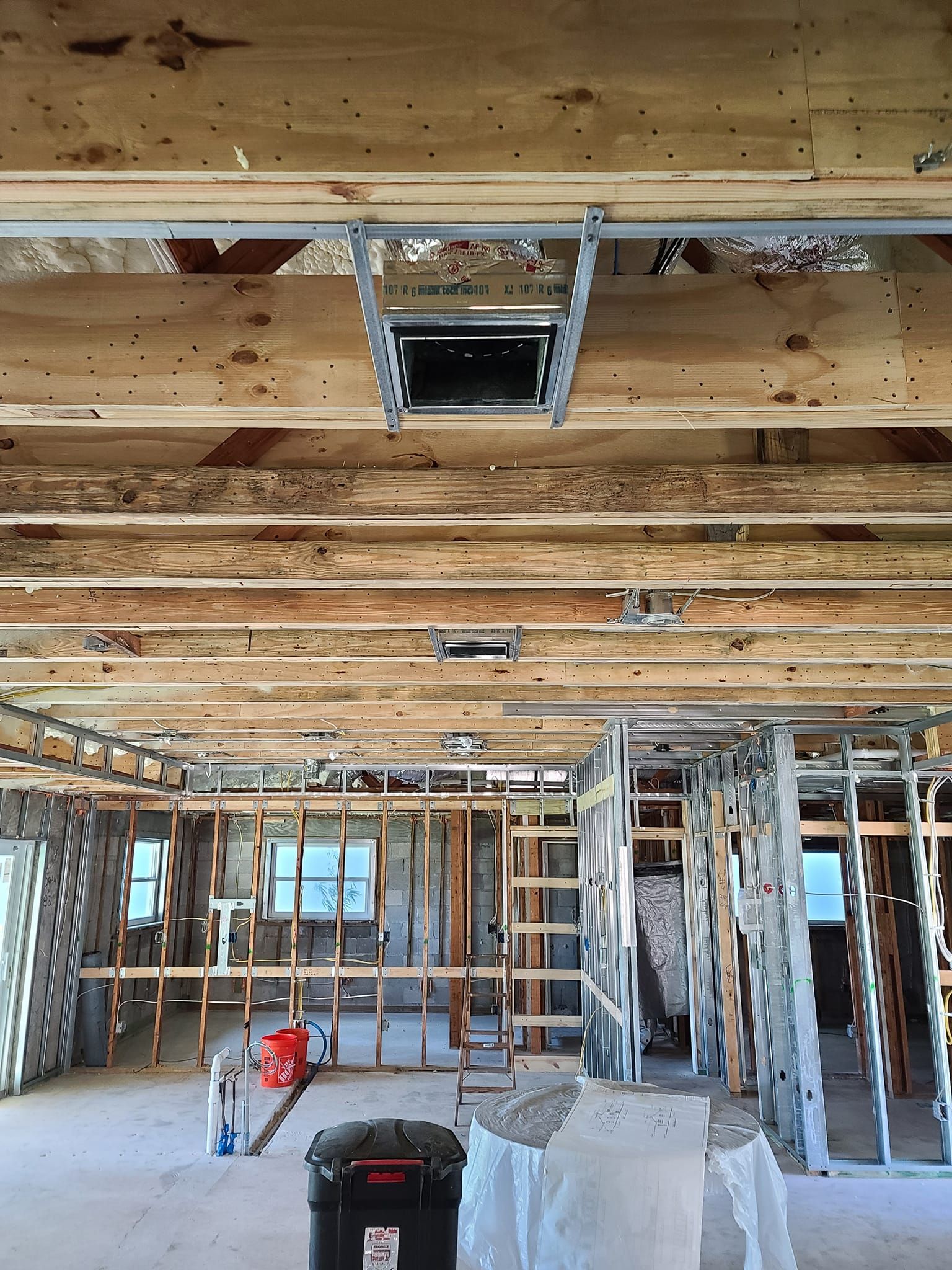 The inside of a building under construction with wooden beams