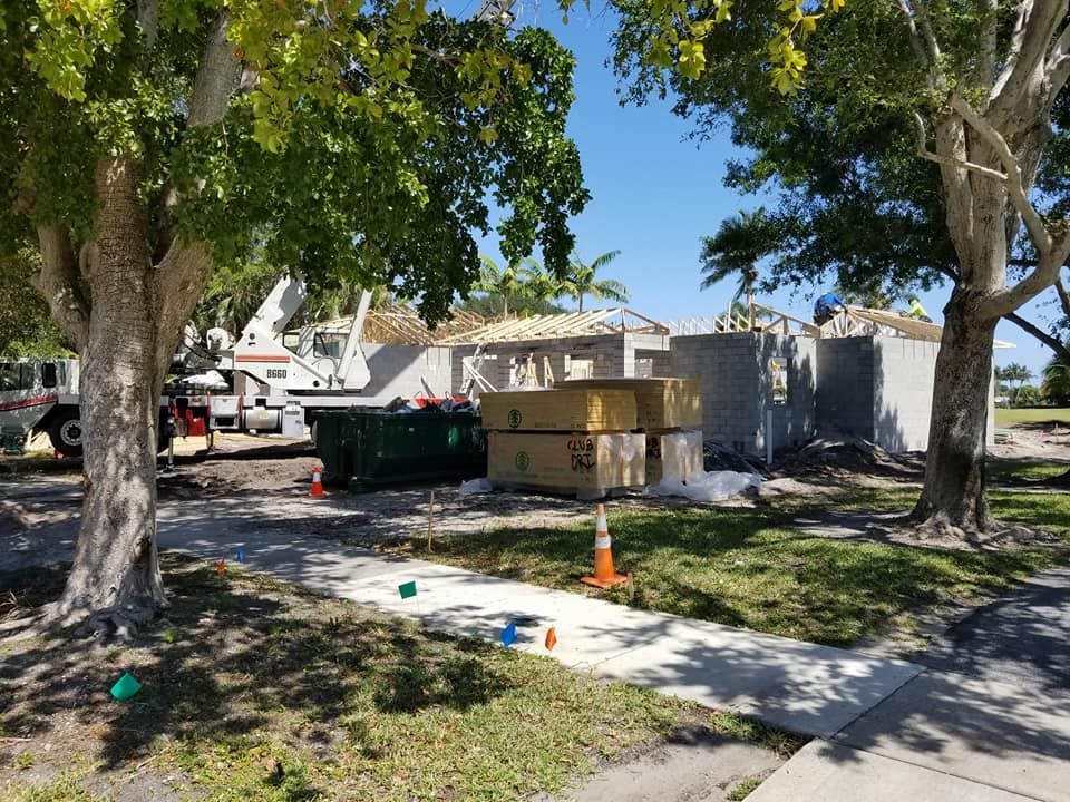 A house is being built in the middle of a residential neighborhood.