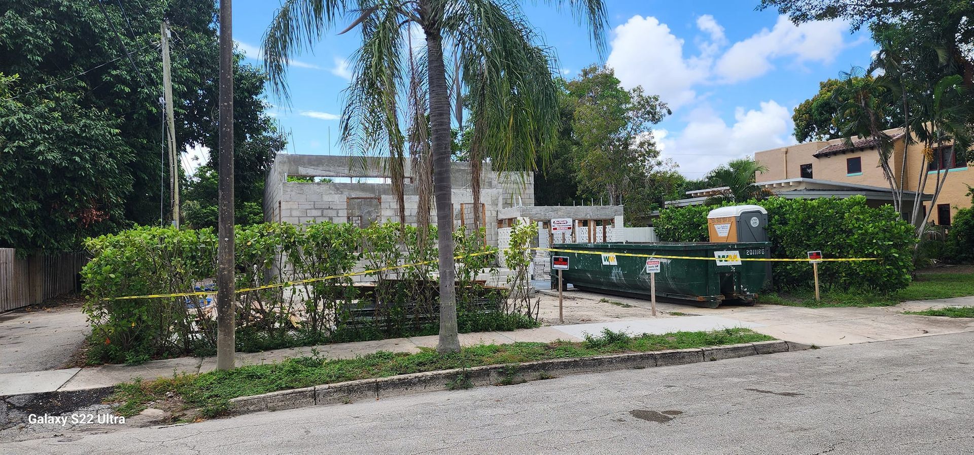 A house is being built in the middle of a residential neighborhood.