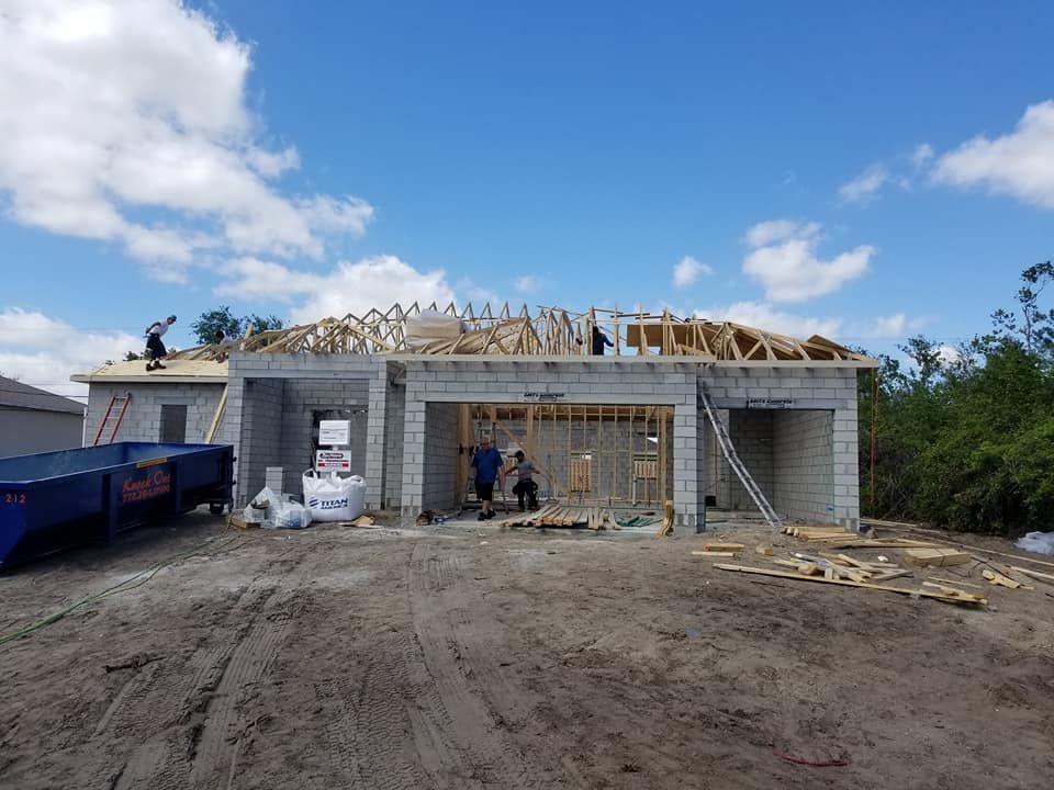 A house is being built with a wooden roof.