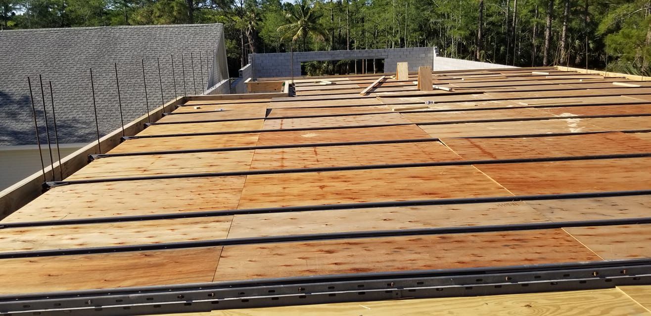 A roof with a lot of wooden boards on it.