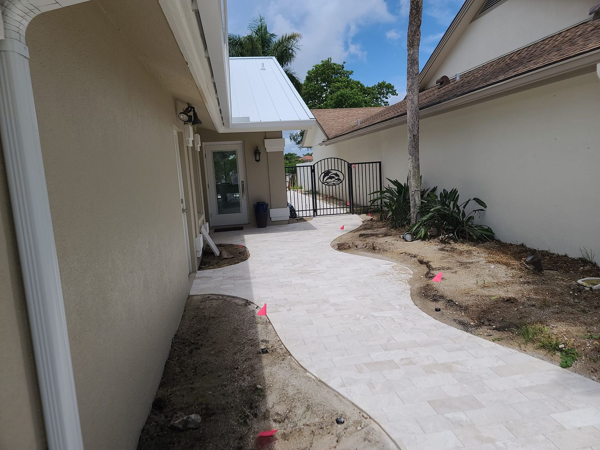 A white house with a walkway leading to it