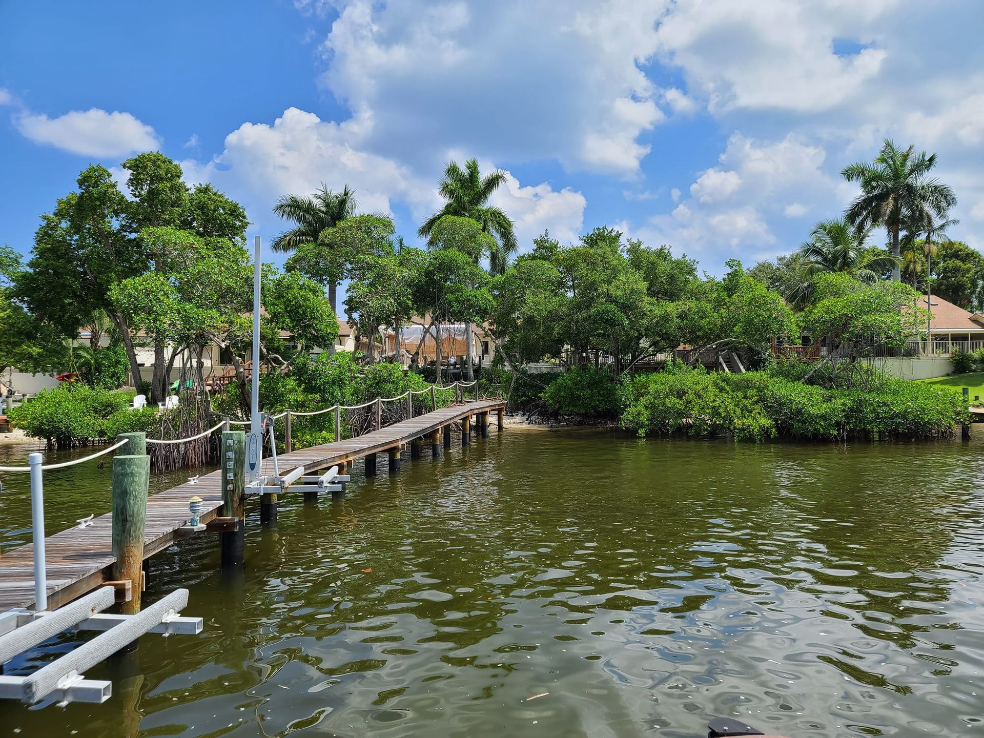 A large body of water with a dock in the middle of it