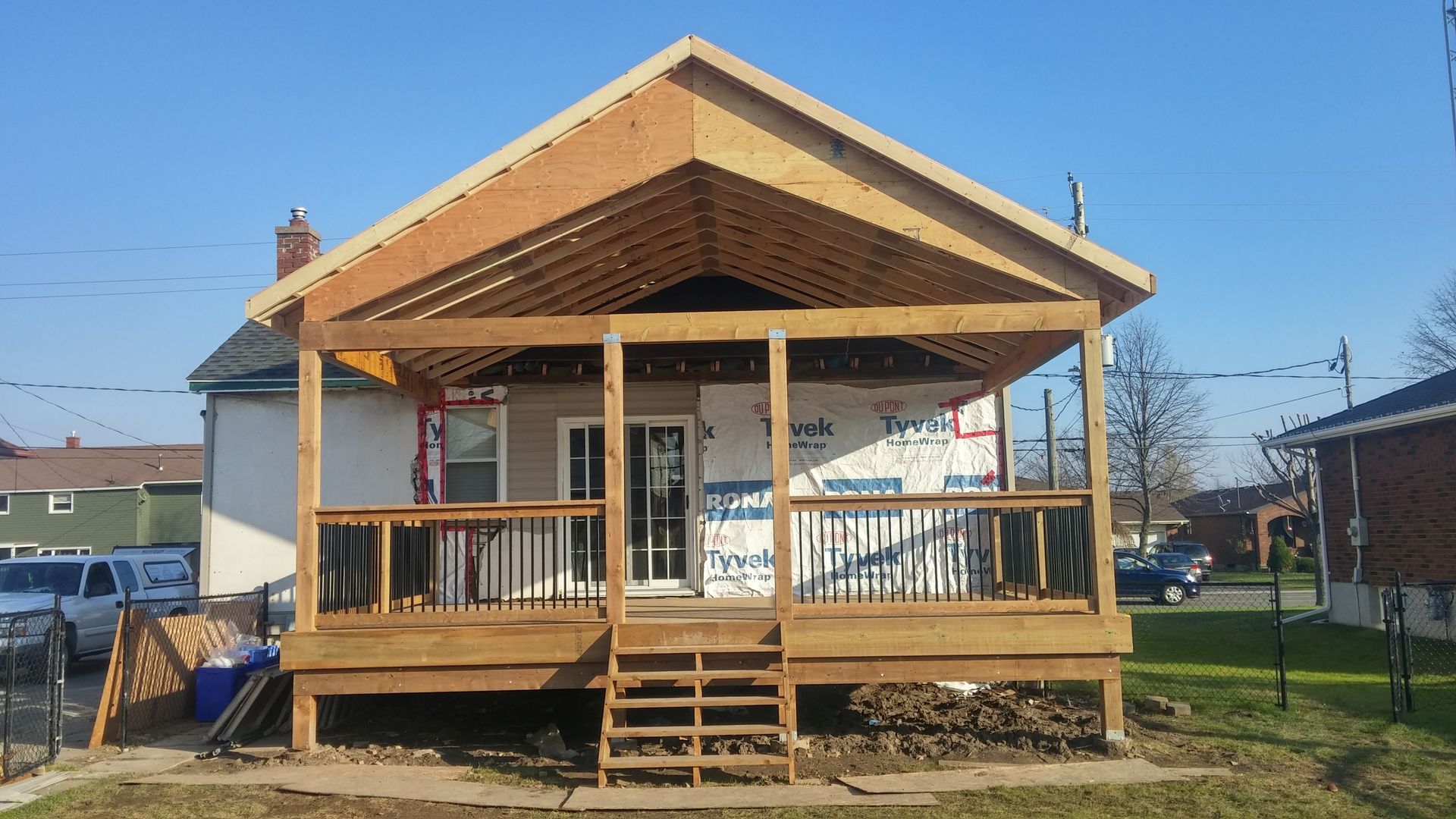 A house with a wooden porch under construction