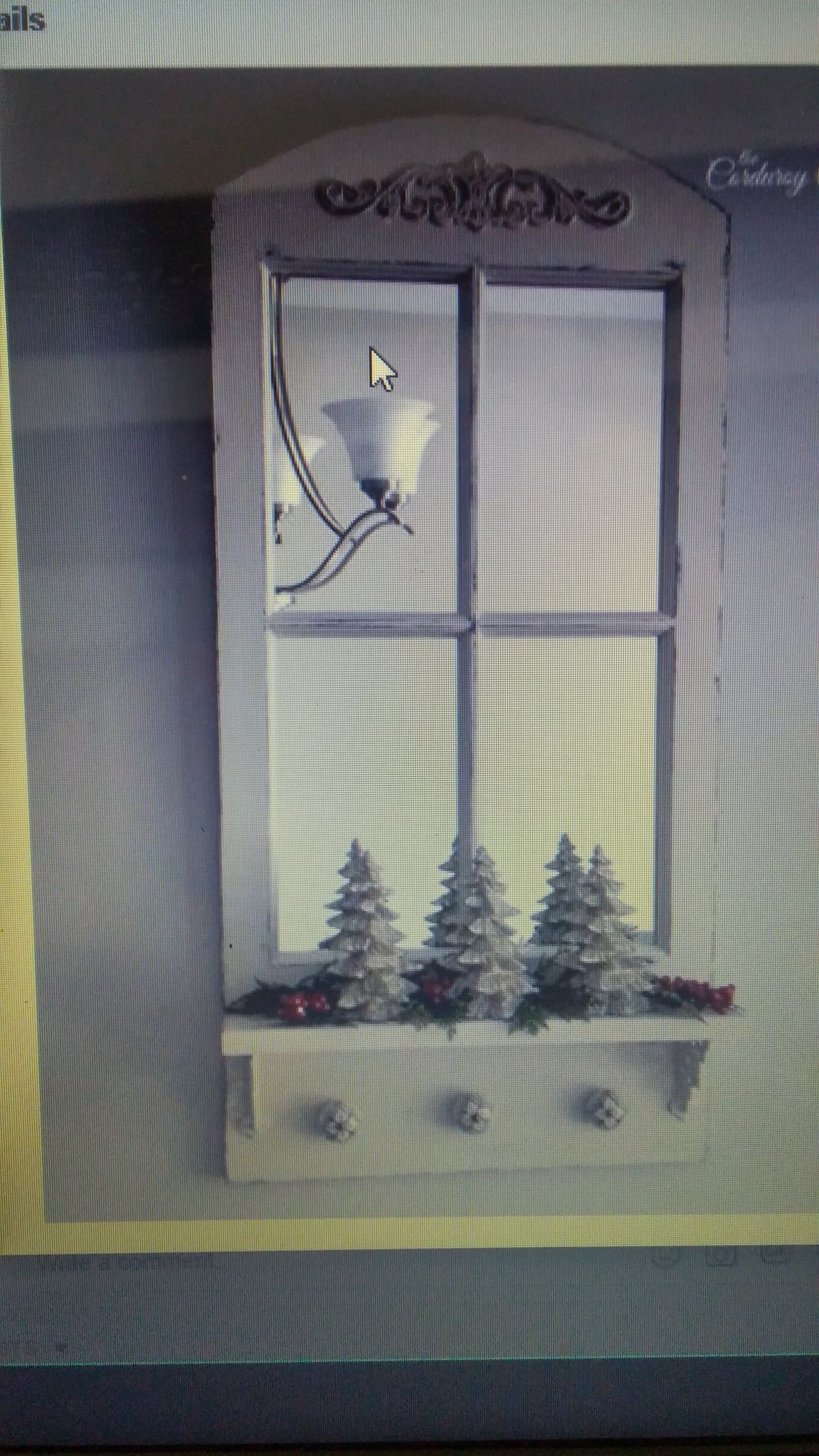 A picture of a window with christmas trees in it