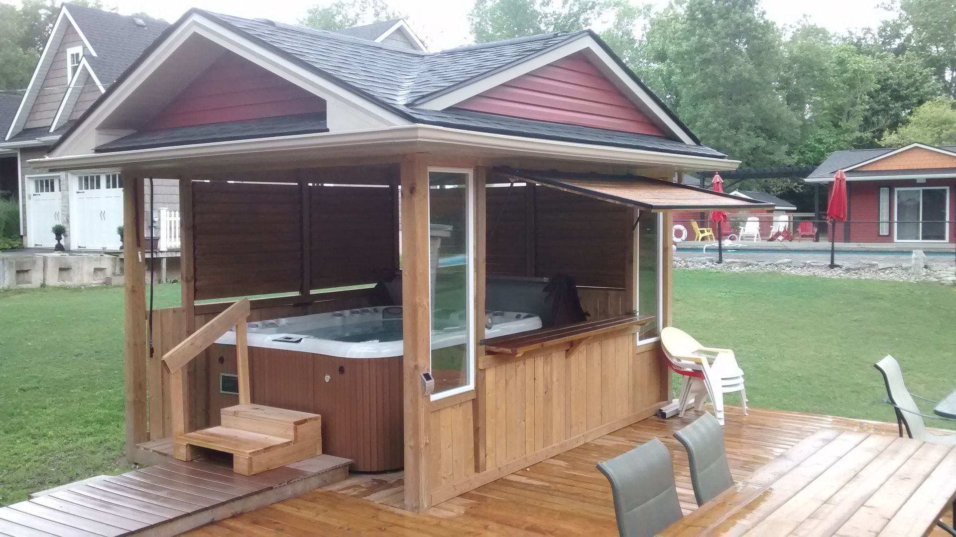 A gazebo with a hot tub inside of it