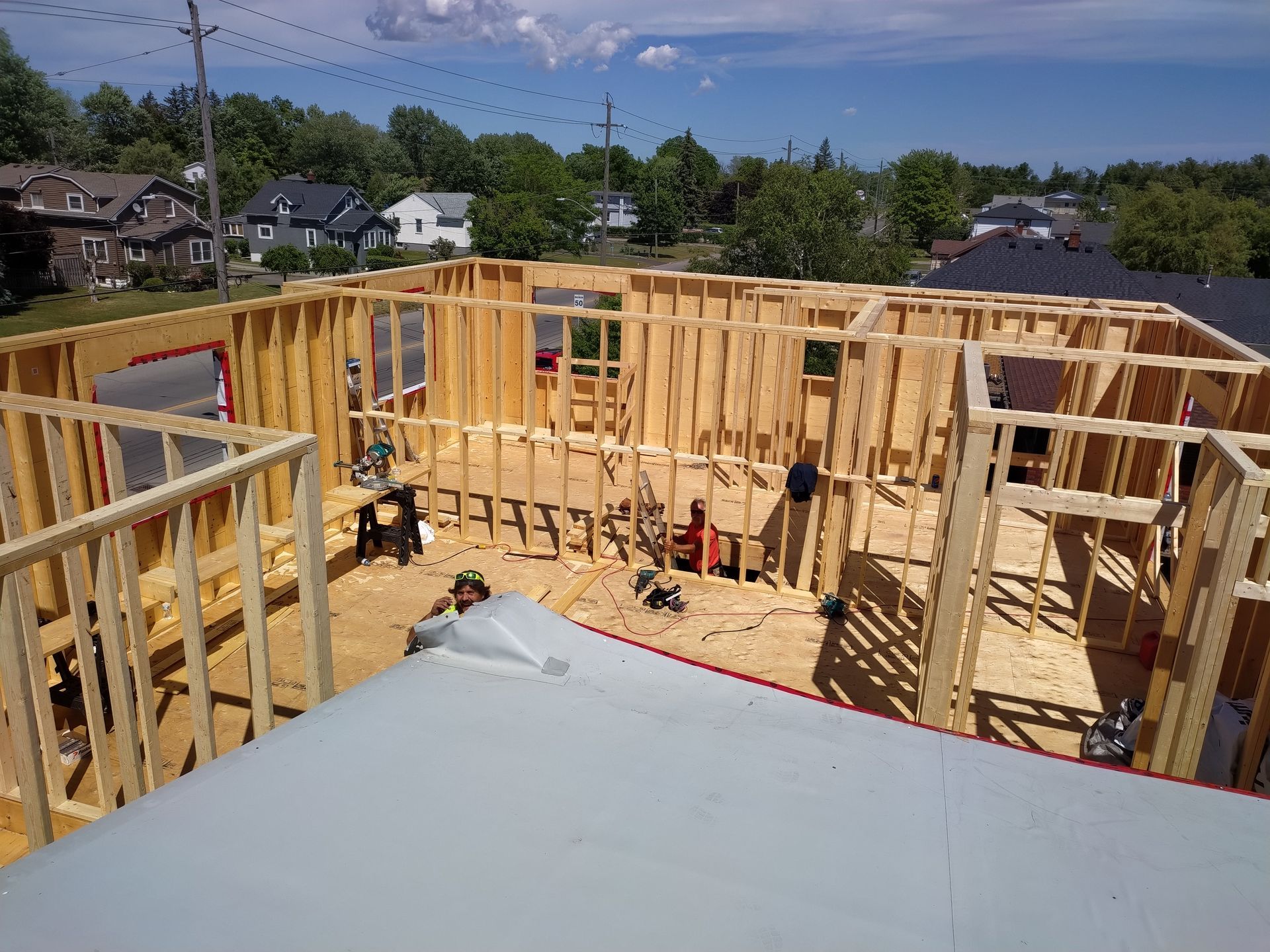 A house is being built in the middle of a city.