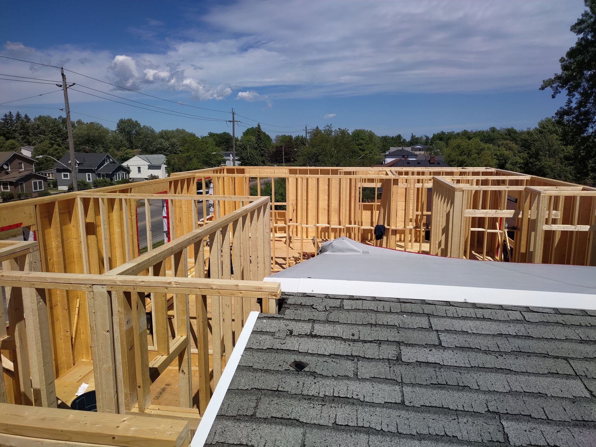 A house is being built in the middle of a residential area.