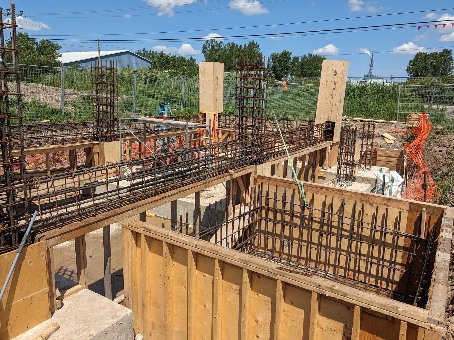 A construction site with a lot of wood and metal.